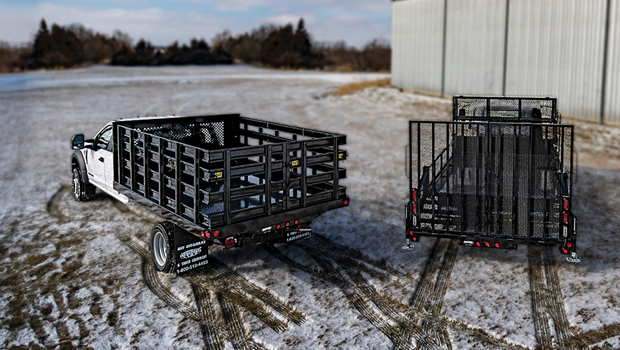 Two Parkhurst work trucks parked in a snowy field
