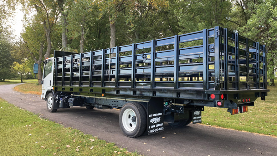Side view of a truck with stake racks