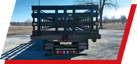 The rear end of a Parkhurst work truck body with stake racks installed
