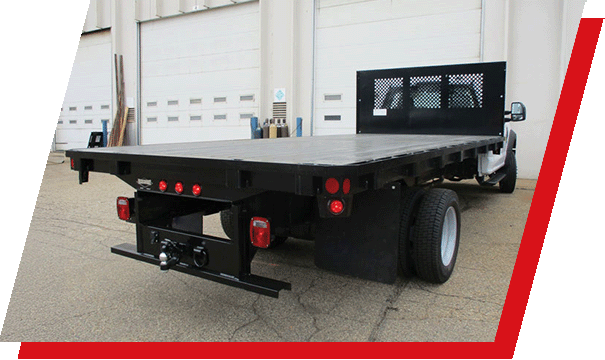 A Parkhurst Structurline body parked in front of a warehouse