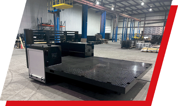 A custom Parkhurst truck bed on the floor of the warehouse